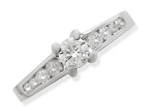 A classic white gold single stone ring in 18ct white gold. One larger central claw set diamond and f