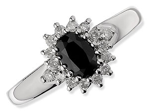 `This classic design is so attractive, with an oval, claw-set dark blue sapphire at the centre, surr