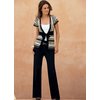 Tie front open style cardigan. Zig zag knit metallic highlights. Hand wash. 94 Acrylic, 4 Polyester,