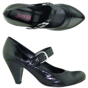 A fashionable Court shoe from Jones Bootmaker. Features brogue style design to the strap and front, 