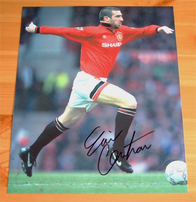 Eric Cantona has signed this superb photo in black pen. COA - 0420000428