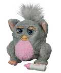 Hey, this is a Furby Baby! Its very little but it likes to have lots of fun! \"Feed\" it its bottle