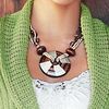 3-strand necklace with wooden beige and brown details. Silver coloured karabiner clasp.