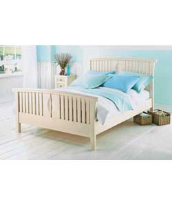 White pine bedstead in modern sleigh design. Latex laminated sprung beech slats, designed to work