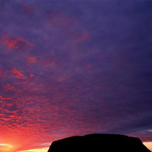 Explore the incredible rock formations of the Kata Tjuta before returning to Ayers Rock to watch the