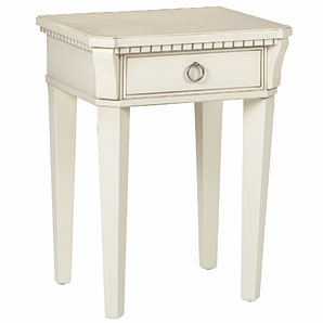 A distinctive bedside table with ornate detailing