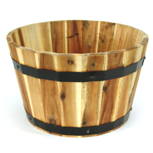 Made from acacia  this traditional wooden barrel-style planter has a superb natural finish. Coated w