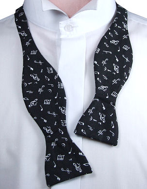 A lovely self-tie bow tie with white music notes all over on black.